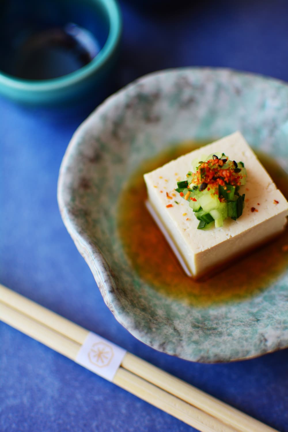 Tofu with cucumber-shichimi sauce presented on the plate