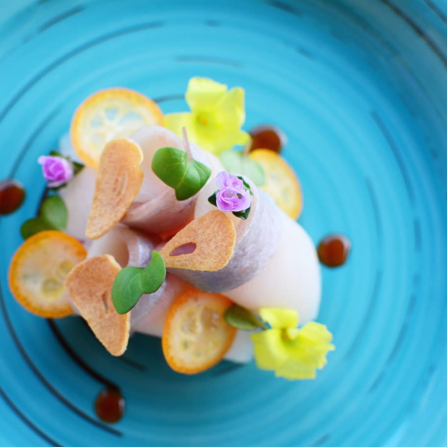 Yellowtail carpaccio presented on the plate